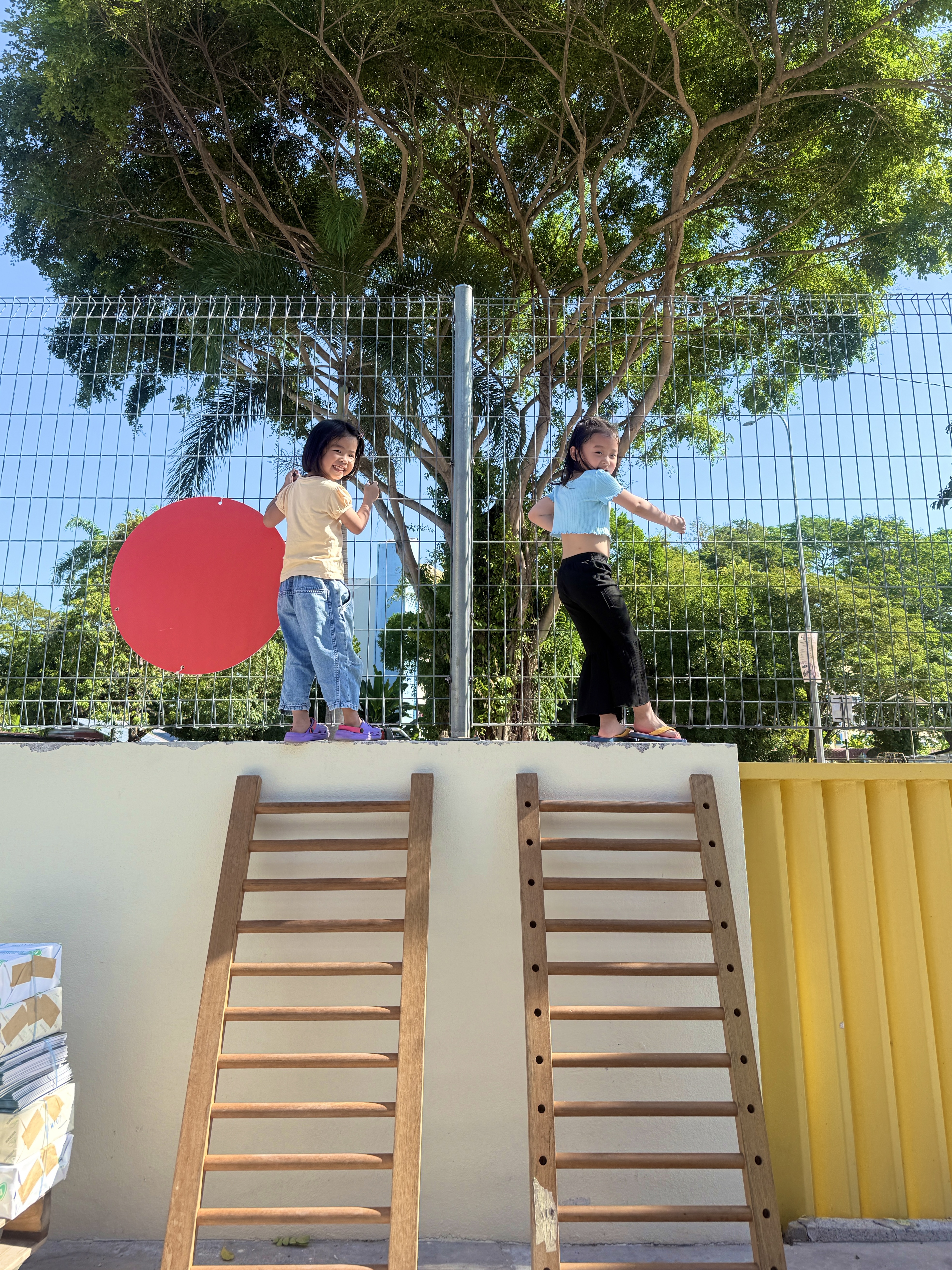 Child climbing and balancing during a WE.PLAY risky play session